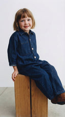 Kız ve erkek çocuk kot tulum; düğmeli, uzun kollu ve cepli tasarımıyla günlük kullanımda konfor sunar. Dayanıklı denim yapısıyla rahat hareket sağlar.&nbsp;Şimdi sipariş verin!