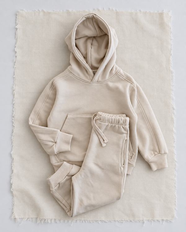RG Brand RG1786 ekru çocuk kapüşonlu eşofman takımı, 3–9 yaş; üst ve pantolonun birlikte görünümü.
