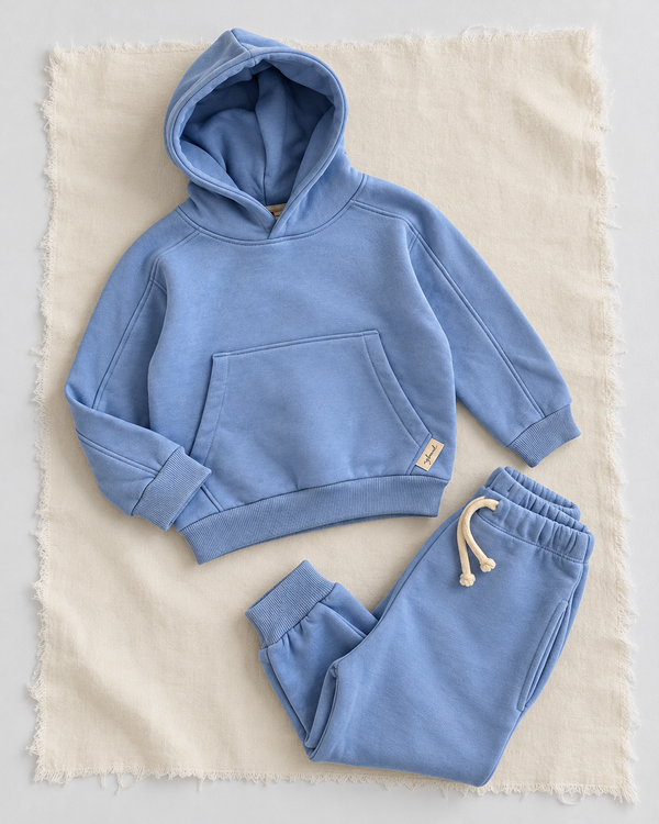 RG Brand RG1786 mavi çocuk kapüşonlu eşofman takımı, 3–9 yaş; üst ve pantolonun ayrı yerleşimi.