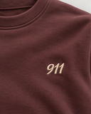 RG Brand RG3746 bordo genç sweatshirt yakın plan; 911 nakışı ve kumaş dokusu.
