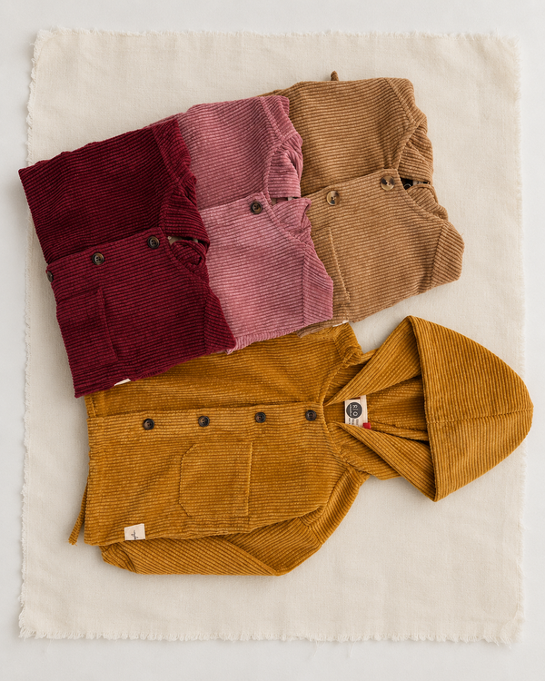 RG Brand RG1798 kids' corduroy jackets in mustard, beige, pink and burgundy, showing fabric, button and pocket details.